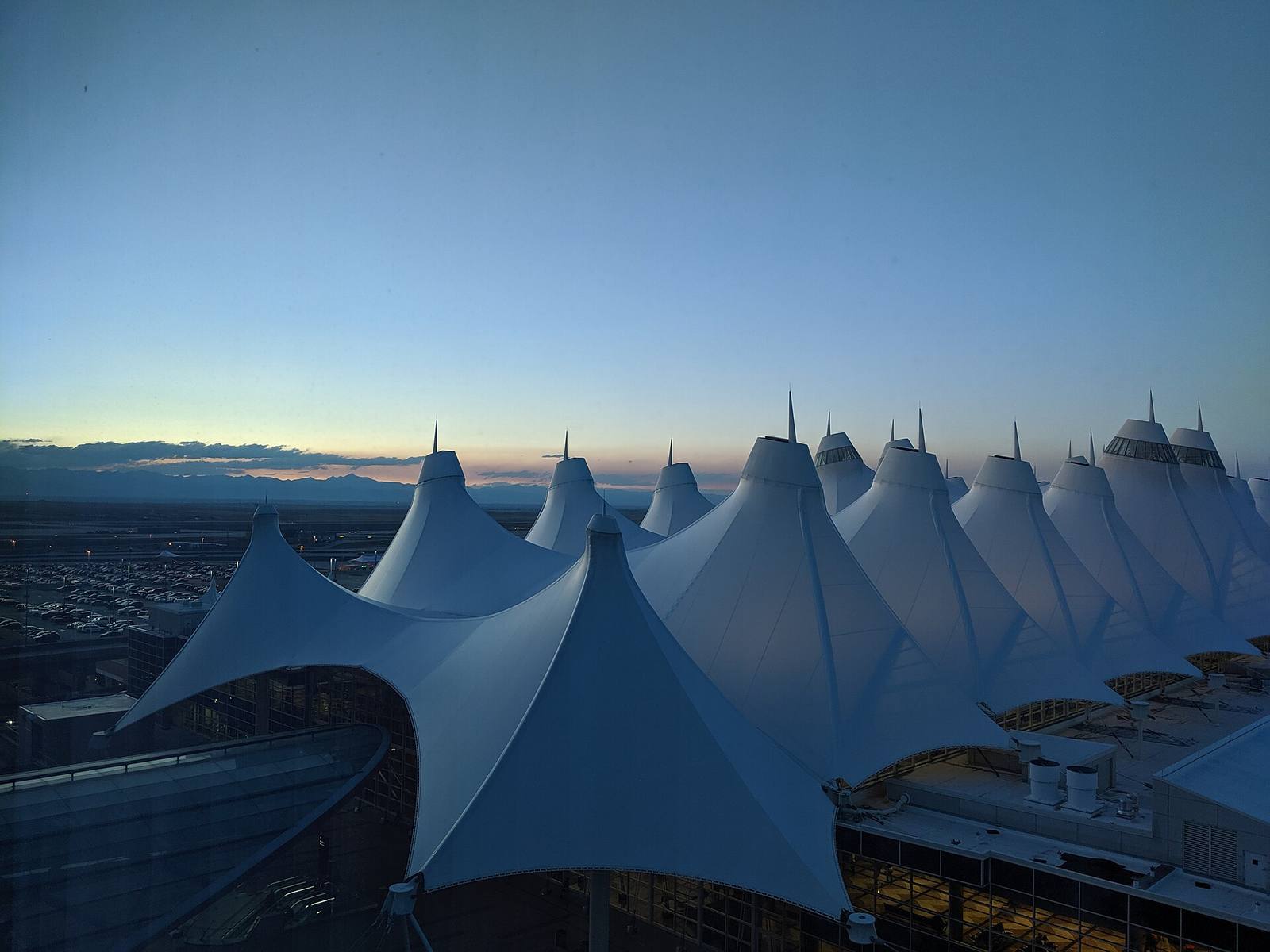 Denver International Airport's main terminal at dusk. DEN served 82,427,962 passengers in 2025, a record, up 0.1 percent from 2024.