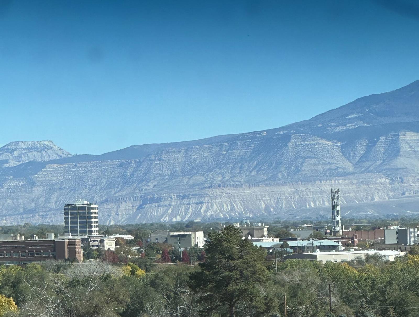 The Grand Junction skyline with the Book Cliffs behind it. State housing staff recommend a $3.25 million loan for the 144-unit Ascent at Salt Flats development in the city.