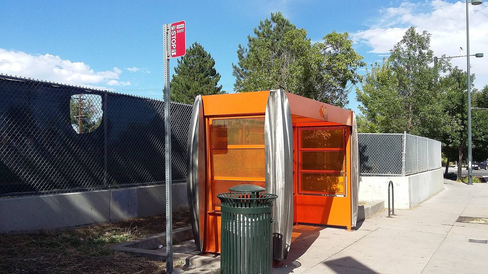 A bus shelter on West Colfax Avenue. Riders on the new section now board at center platforms in the middle of the street.