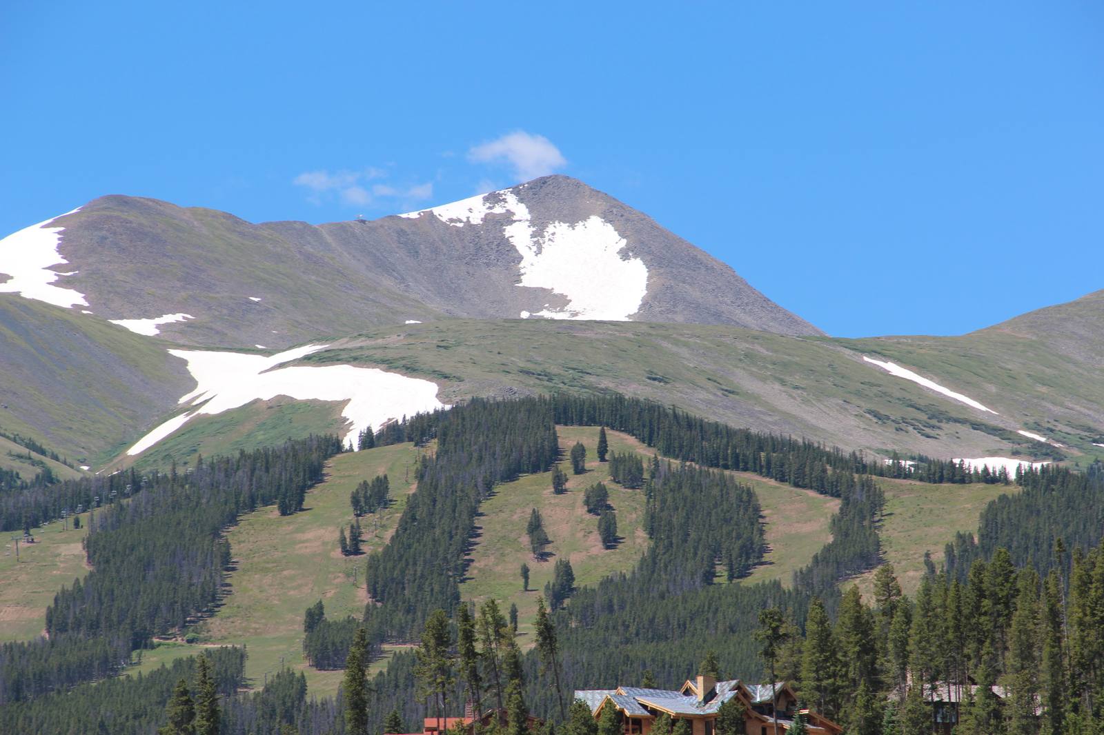 Peak 10 rises over the ski runs above Breckenridge in a file photograph from July 2016. The town's annual charge on short-term rental licenses, $756 per bedroom, is now headed to the Colorado Supreme Court.