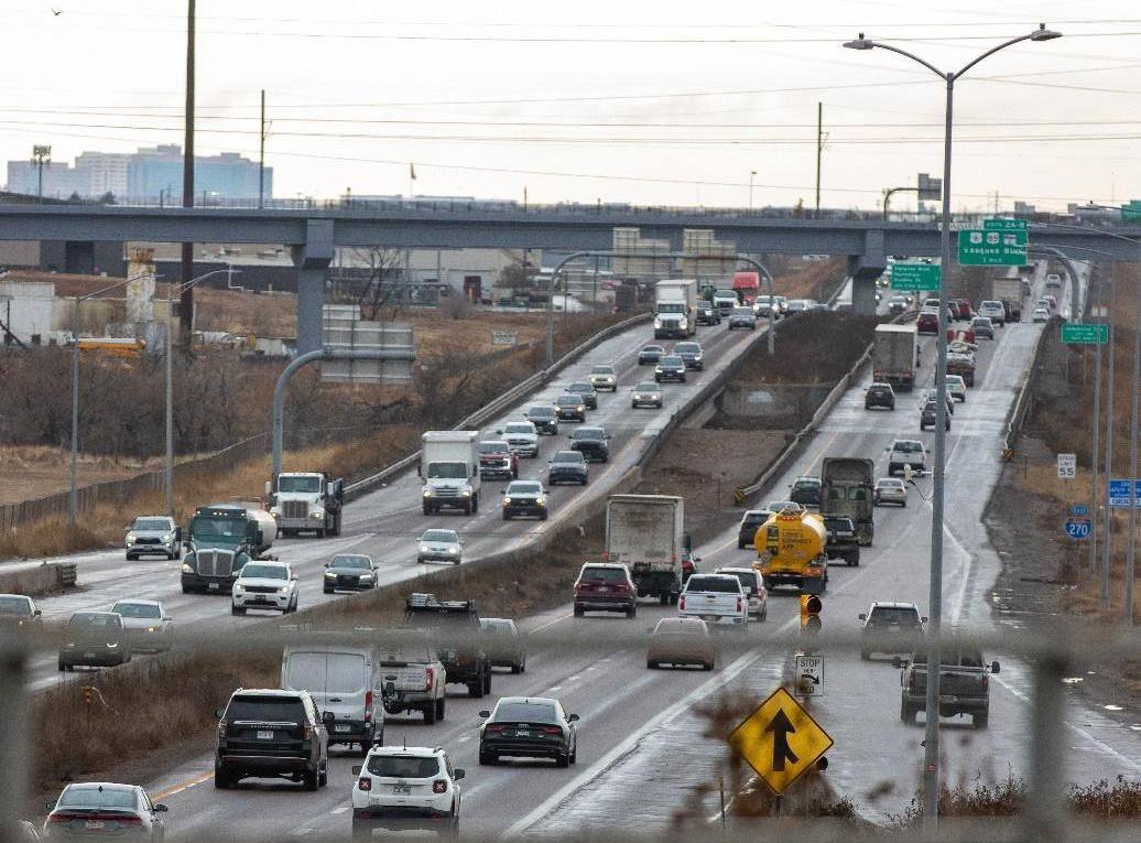 Traffic on Interstate 270 near the Vasquez Boulevard signs, in a Colorado Department of Transportation photograph from the project's environmental record. The corridor carries more than 100,000 vehicles a day, and construction on its $806 million rebuild is now underway.